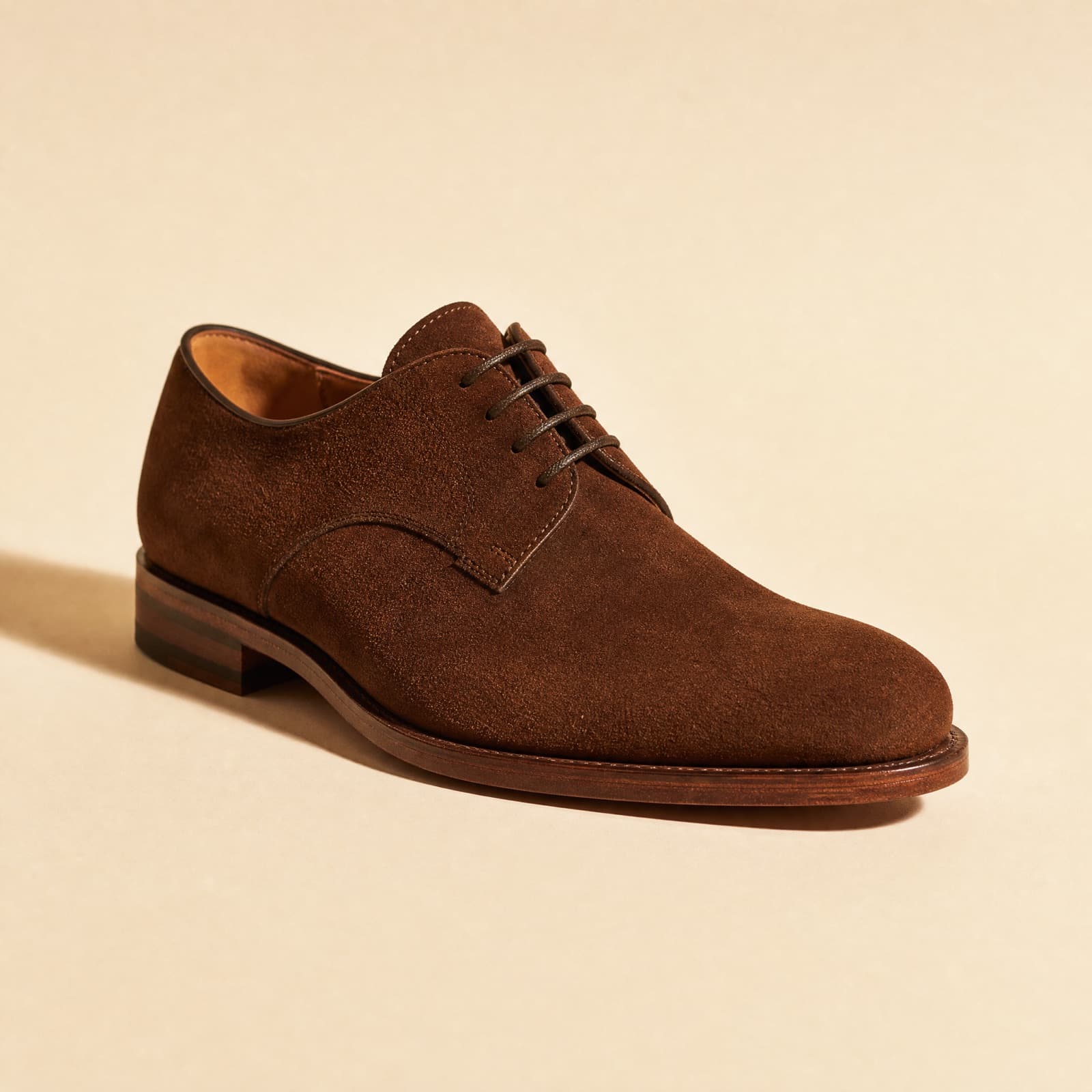 Derby Suede — Suede calf, open lacing, natural-edge sole.