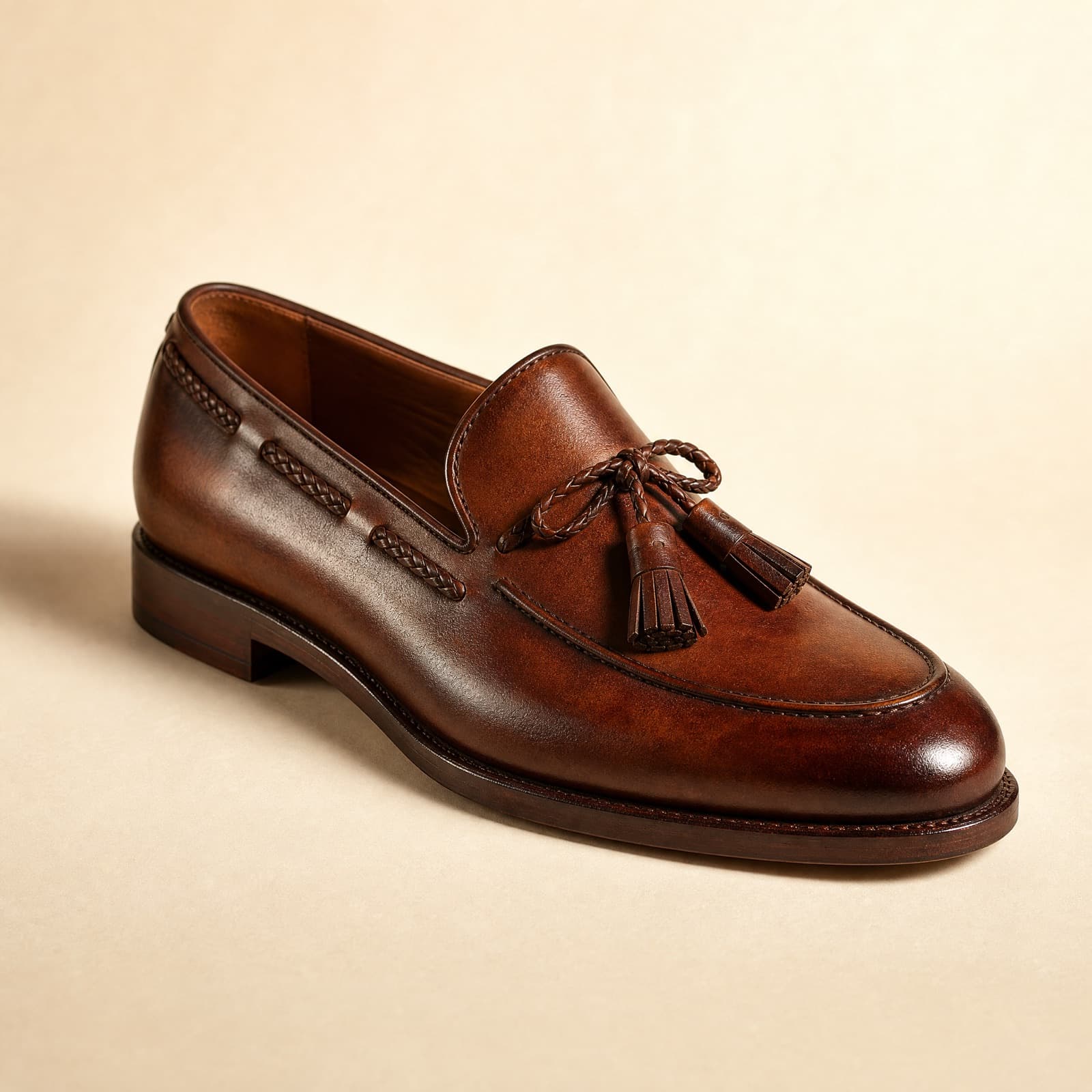 Tassel Loafer — A braided lace around the collar, two tassels.